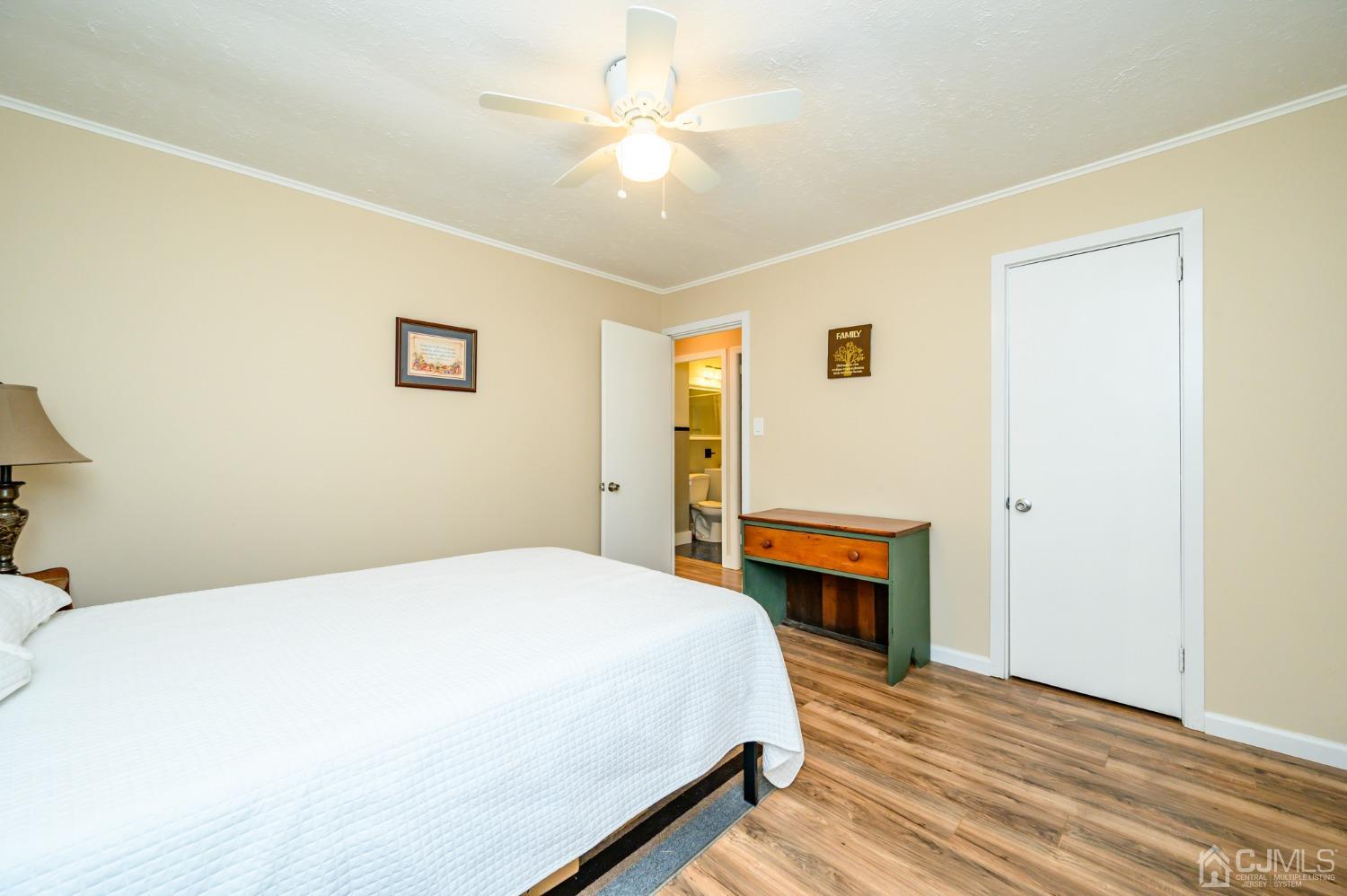 217 Clamer Road Ewing, NJ 08628 - Photo 18 of 29 a bedroom with a bed and a fireplace