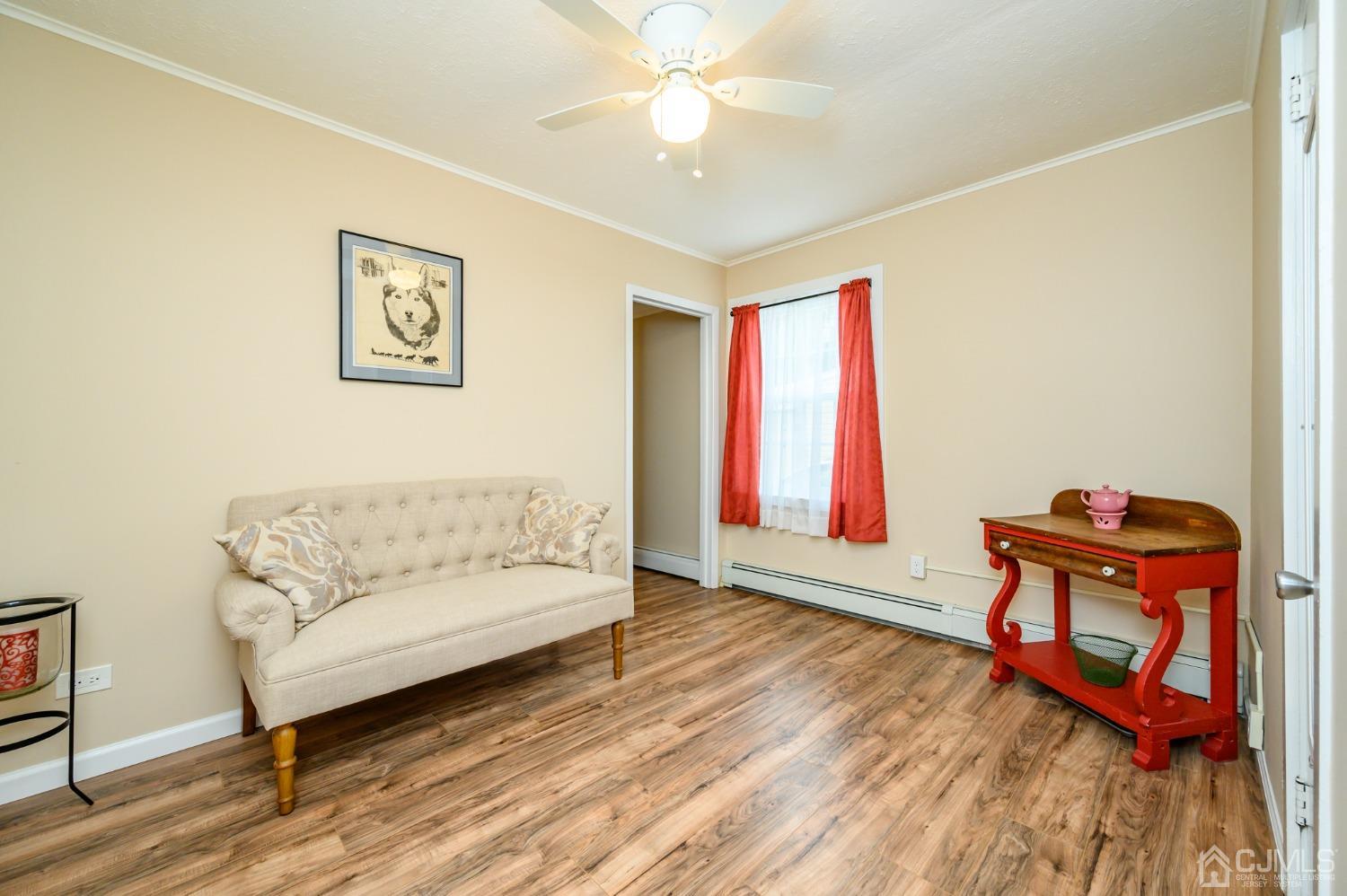 217 Clamer Road Ewing, NJ 08628 - Photo 19 of 29 a living room with furniture a window and a flat screen tv