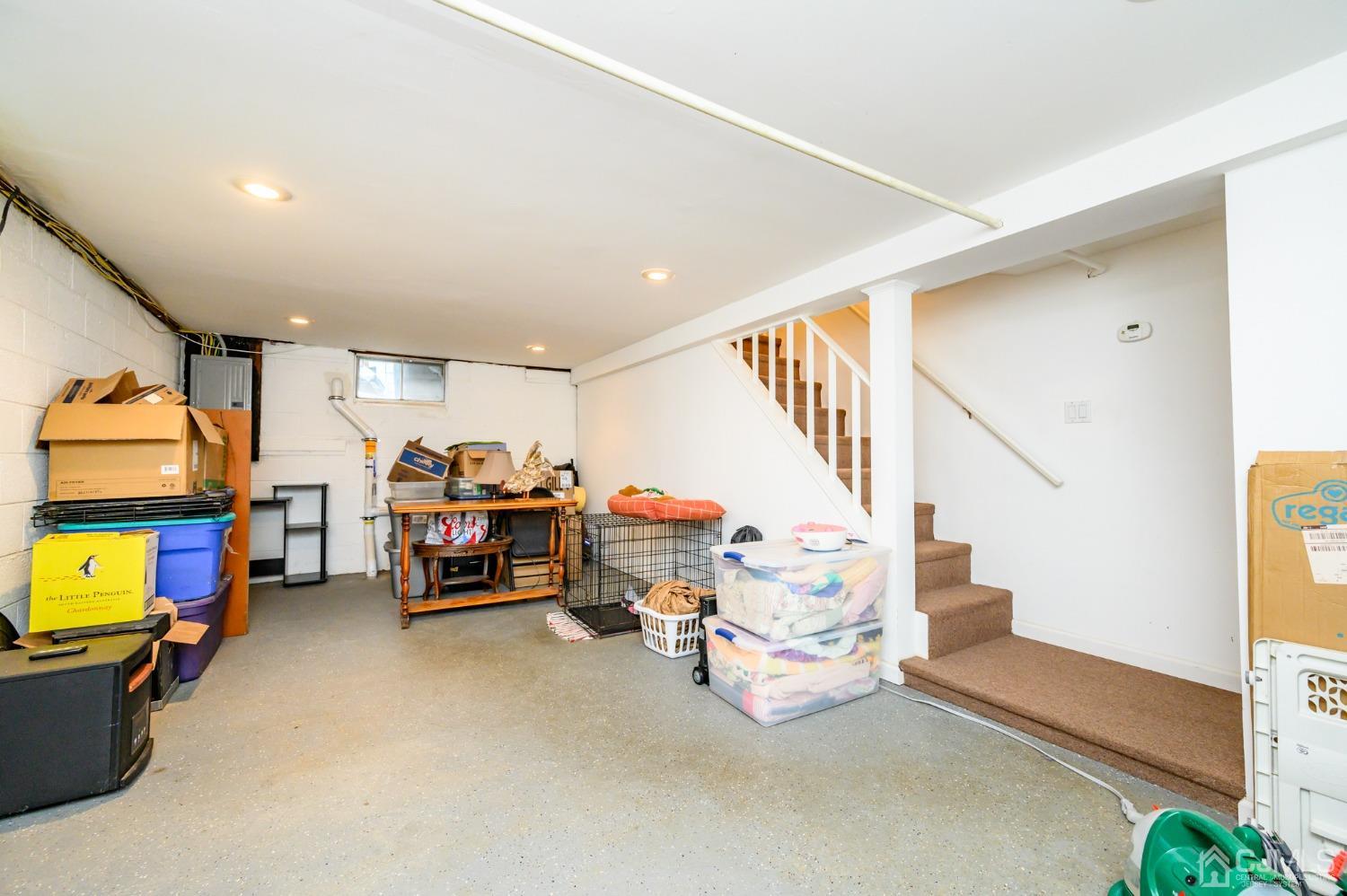 217 Clamer Road Ewing, NJ 08628 - Photo 23 of 29 a living room with furniture and a flat screen tv