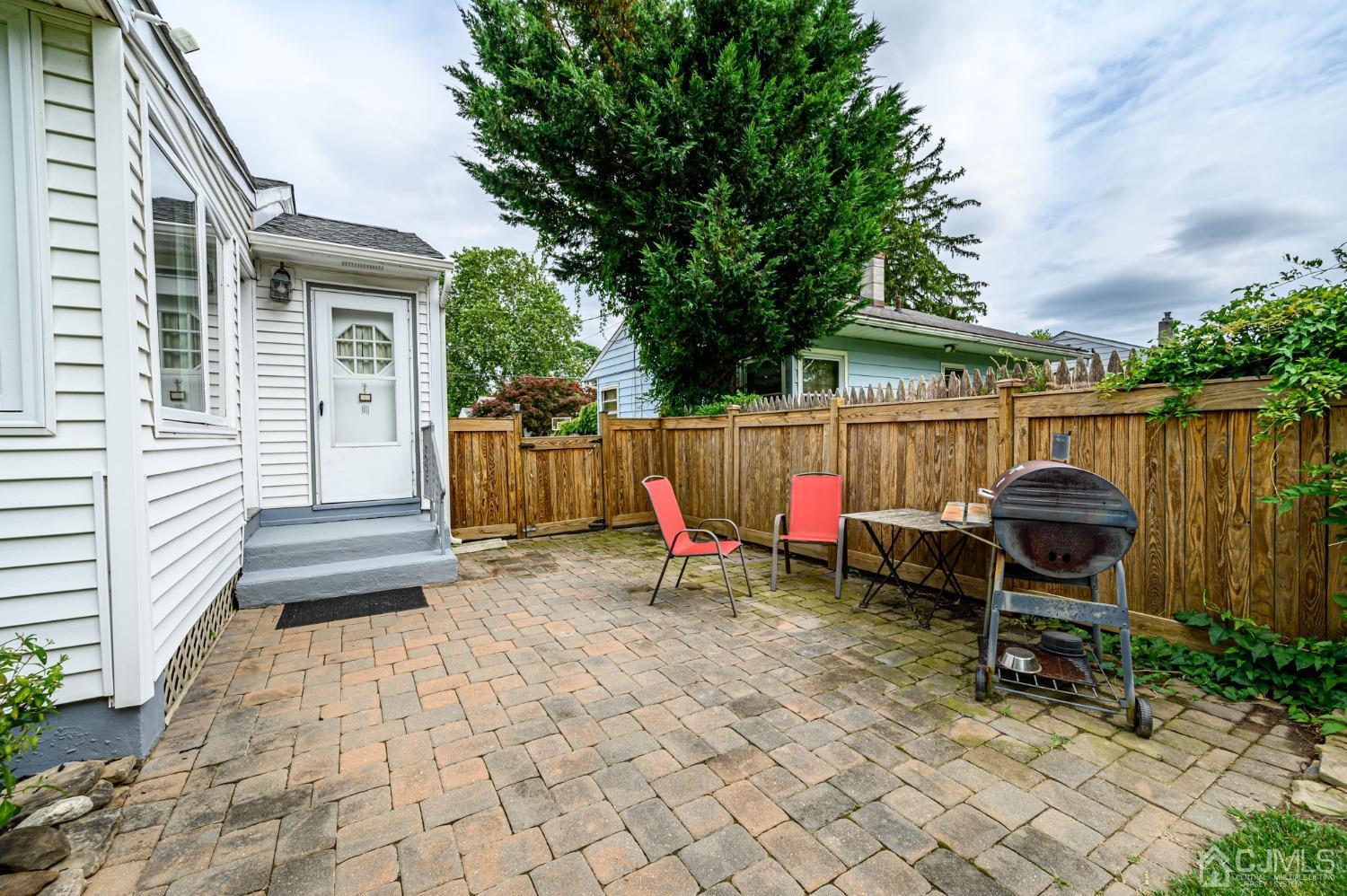 217 Clamer Road Ewing, NJ 08628 - Photo 25 of 29 a view of a chairs and table in the back yard of the house