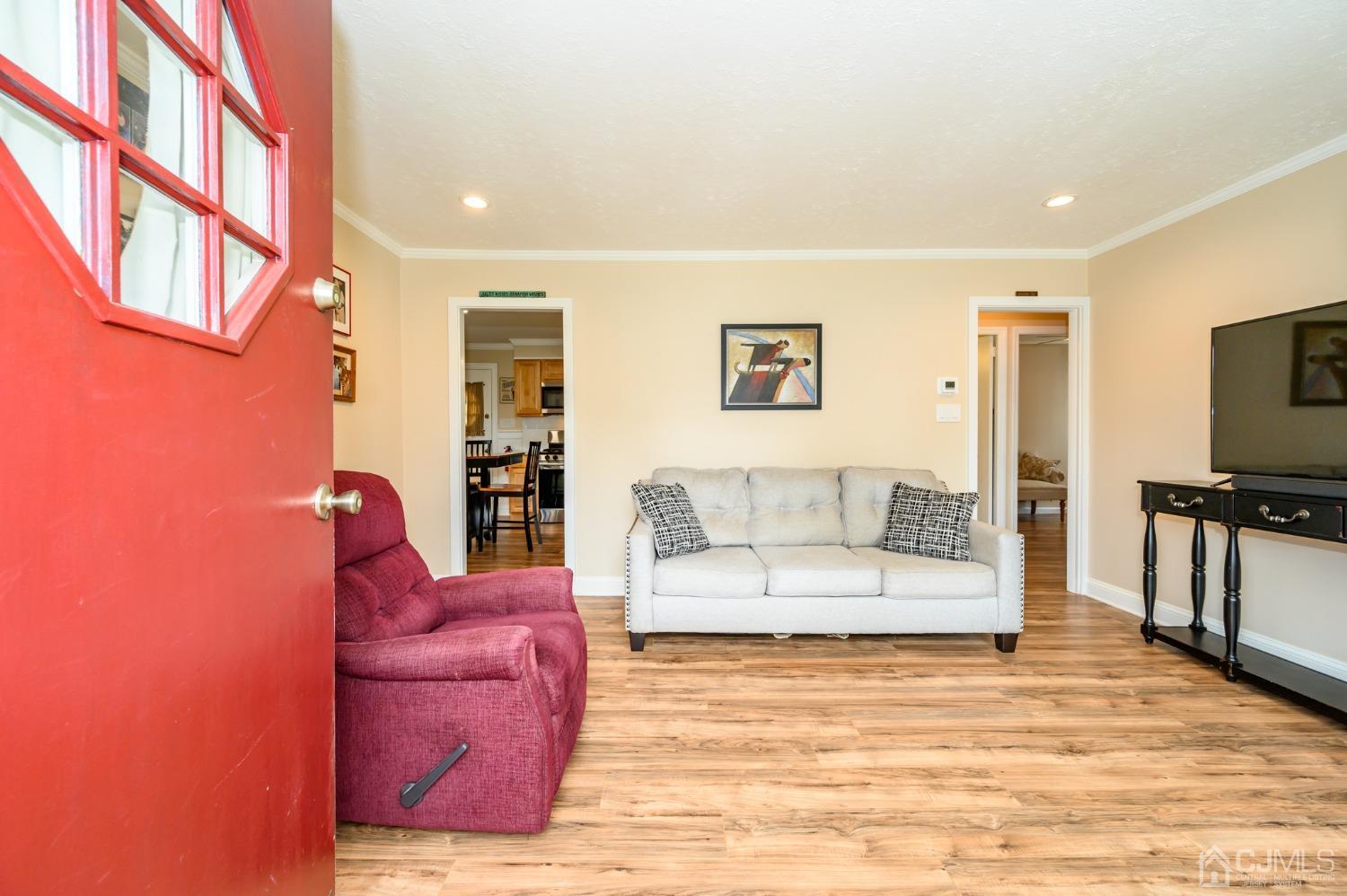 217 Clamer Road Ewing, NJ 08628 - Photo 3 of 29 a living room with furniture and a flat screen tv