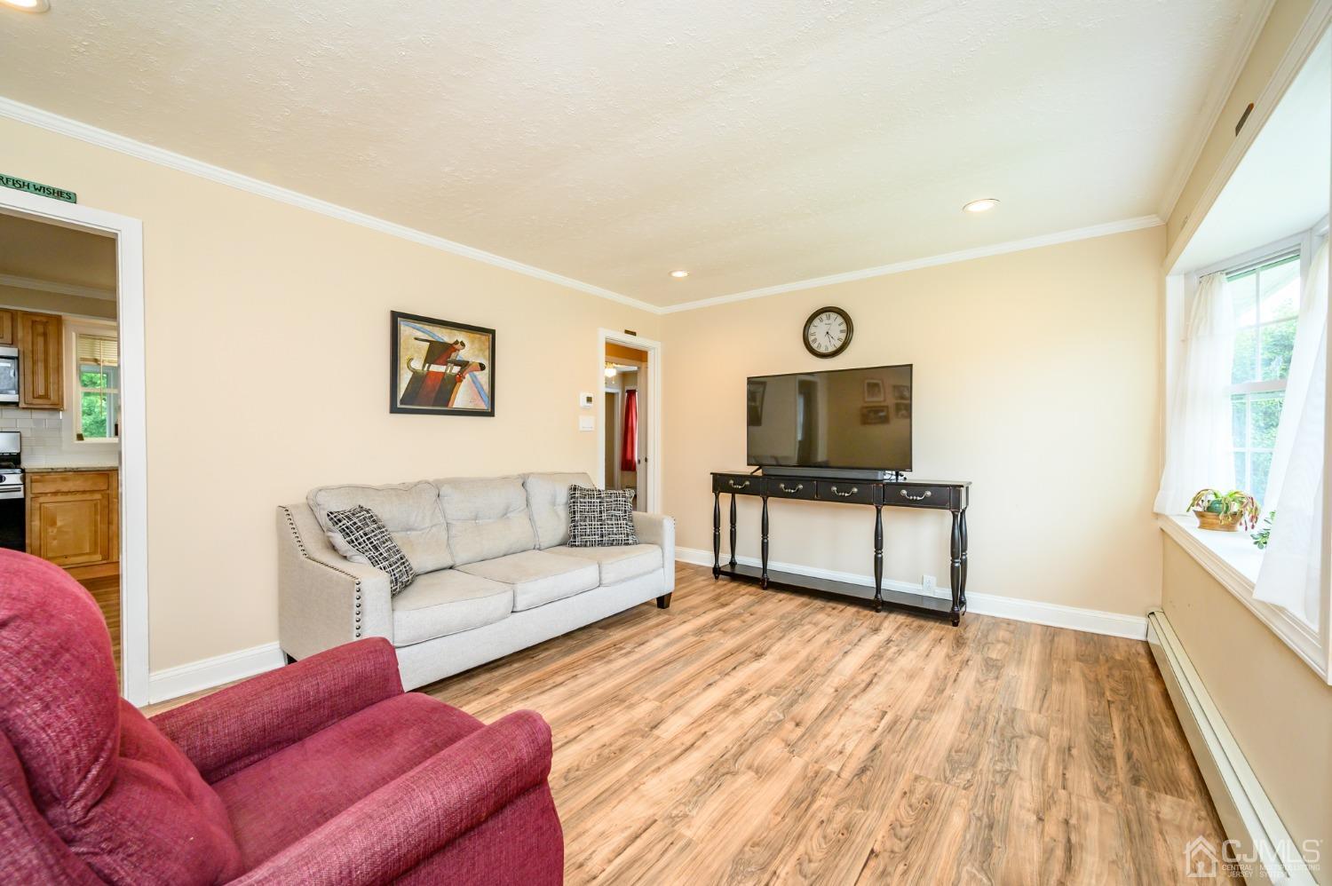 217 Clamer Road Ewing, NJ 08628 - Photo 4 of 29 a living room with furniture and a flat screen tv