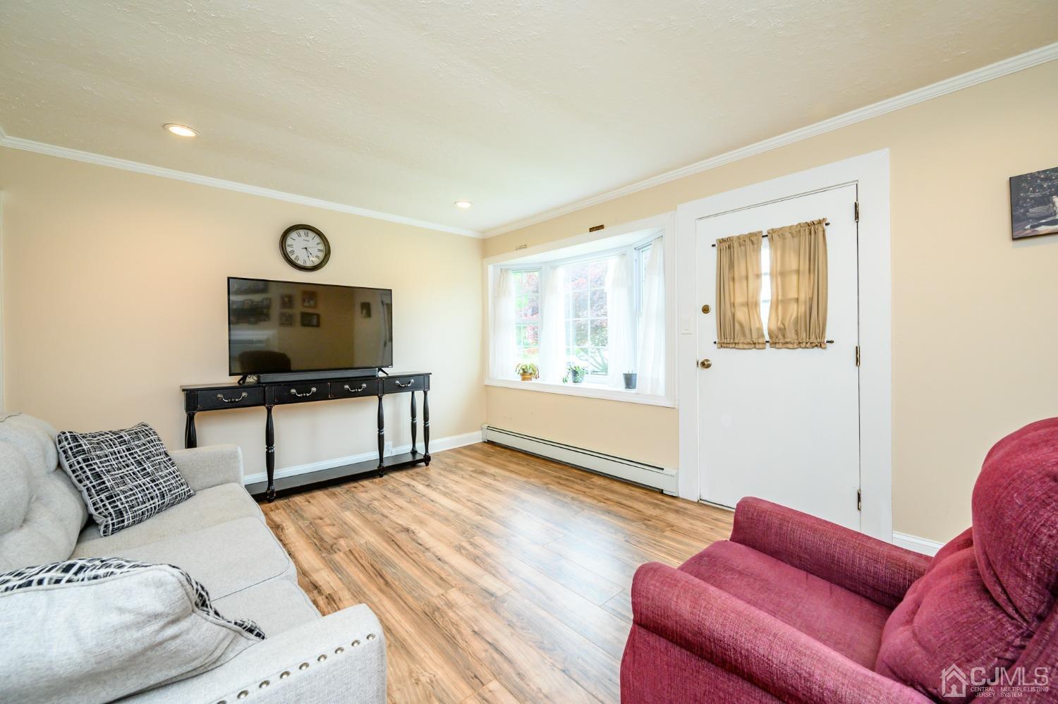 217 Clamer Road Ewing, NJ 08628 - Photo 5 of 29 a living room with furniture and a flat screen tv