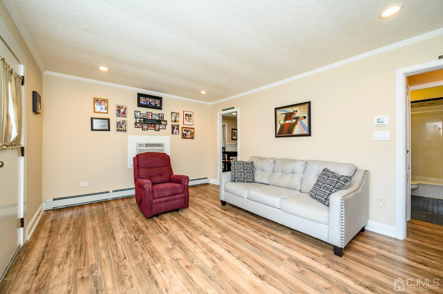 217 Clamer Road Ewing, NJ 08628 - Photo 6 of 29 a living room with furniture and a wooden floor