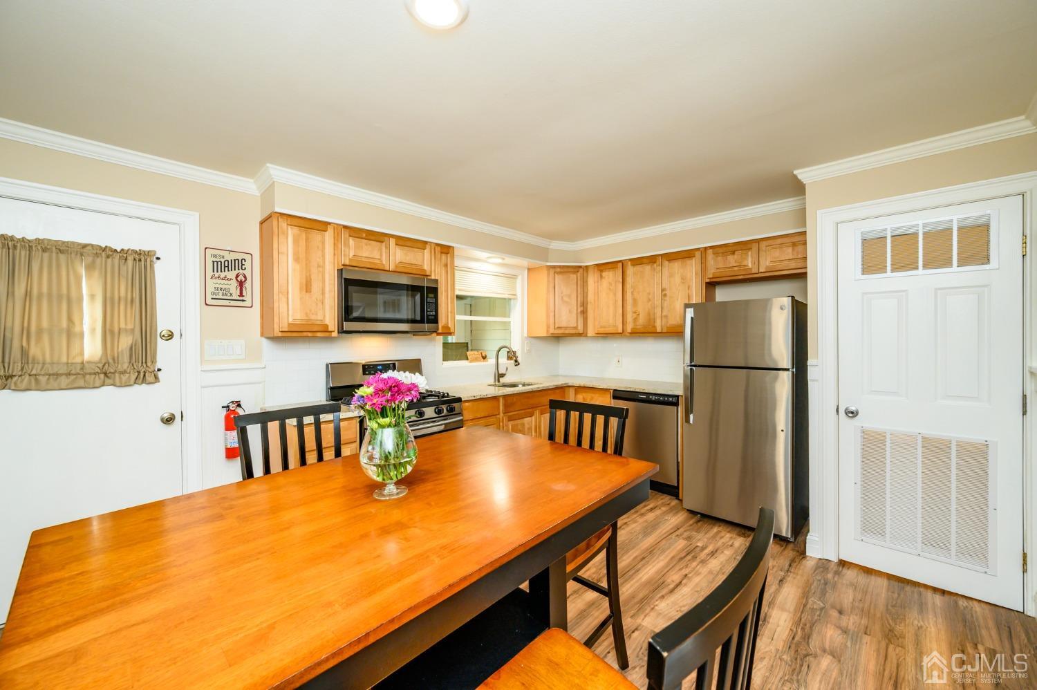 217 Clamer Road Ewing, NJ 08628 - Photo 8 of 29 a view of a dining room with furniture and a kitchen
