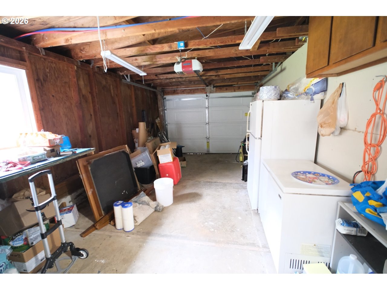 70214 Lakewood Road North Bend, OR 97459 - Photo 28 of 39 a view of a storage & utility room with washer and dryer