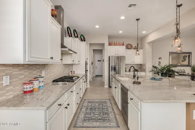 a bathroom with a sink a mirror and a light fixture