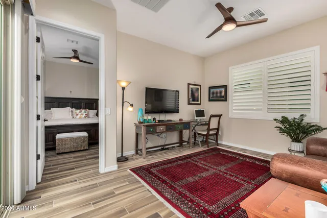 a view of a patio with table and chairs and potted plants