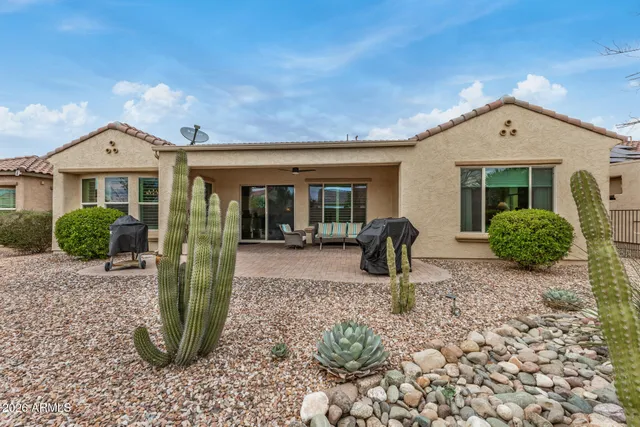 an aerial view of a house with a lake view