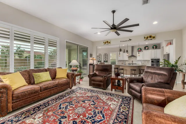 a view of kitchen with dining area refrigerator and wooden floor