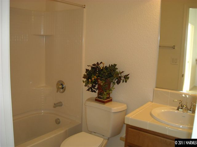 2150 Stanhope Lane Reno, NV 89502 - Photo 7 of 13 a bathroom with a sink toilet and shower
