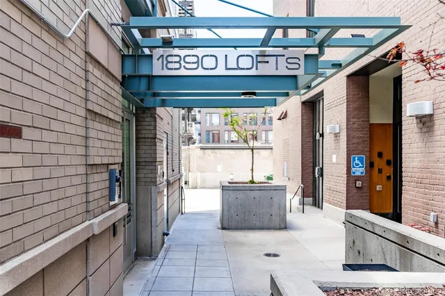a view of a street with an outdoor seating