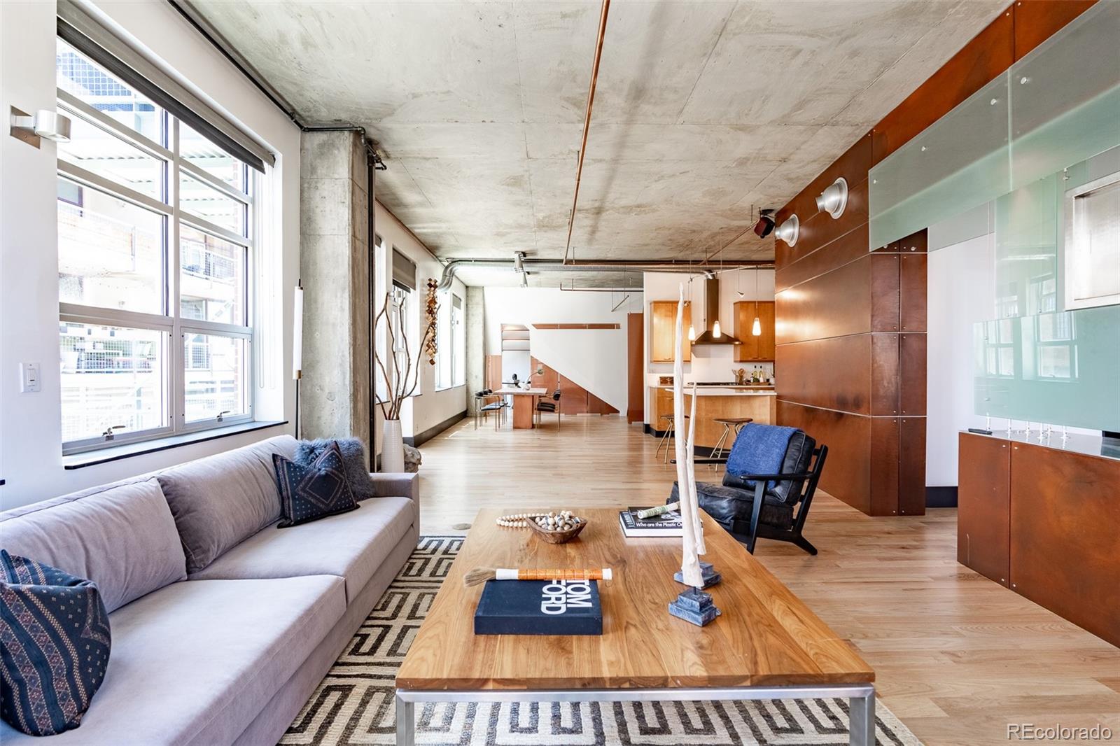 1890 Wynkoop Street, Unit 604 Denver, CO 80202 - Photo 19 of 26 a living room with furniture and a large window