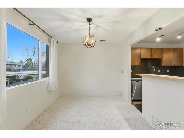 a view of a kitchen and a microwave