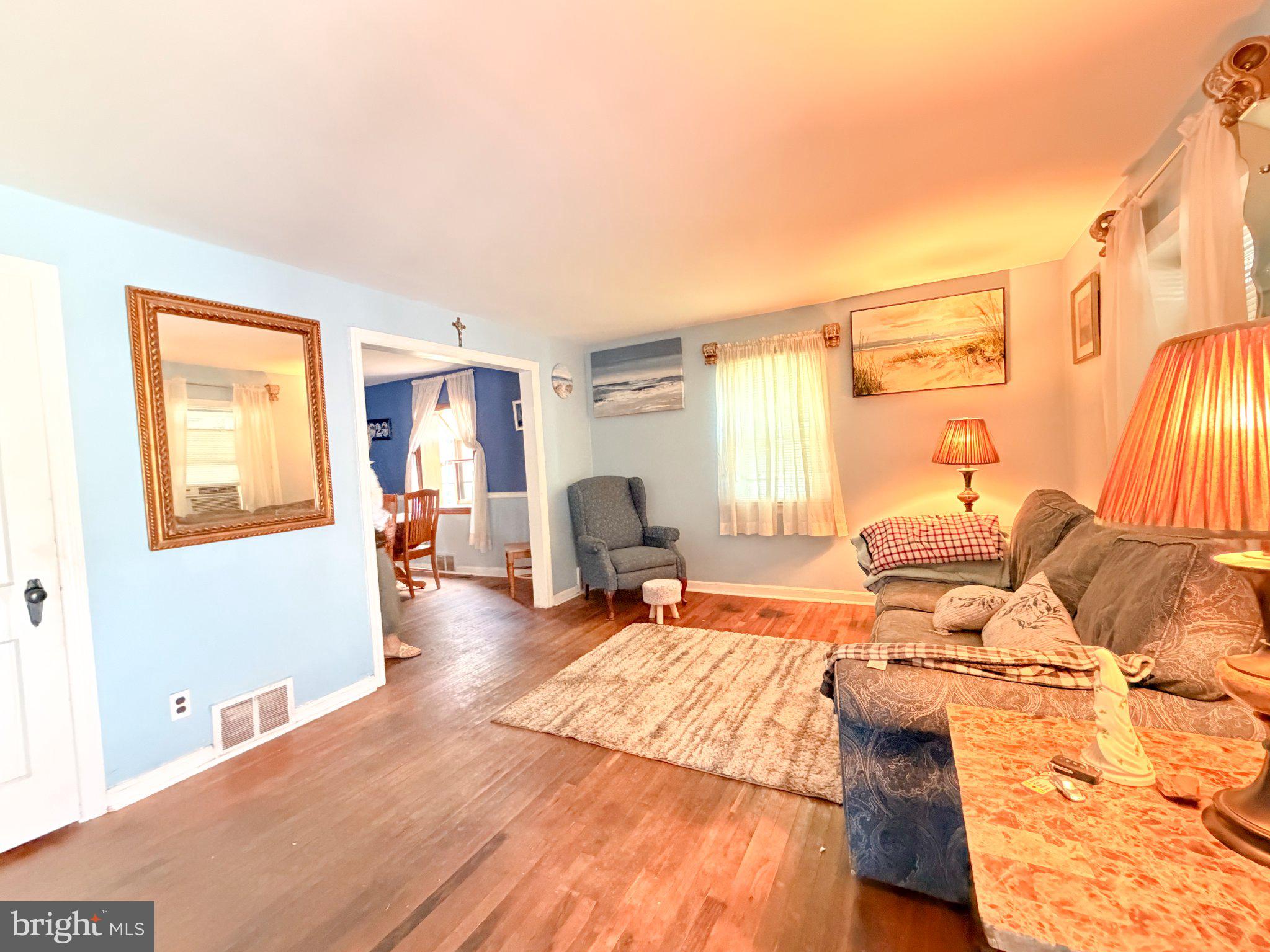 646 Amosland Road Morton, PA 19070 - Photo 3 of 11 Cozy living space with warm light.