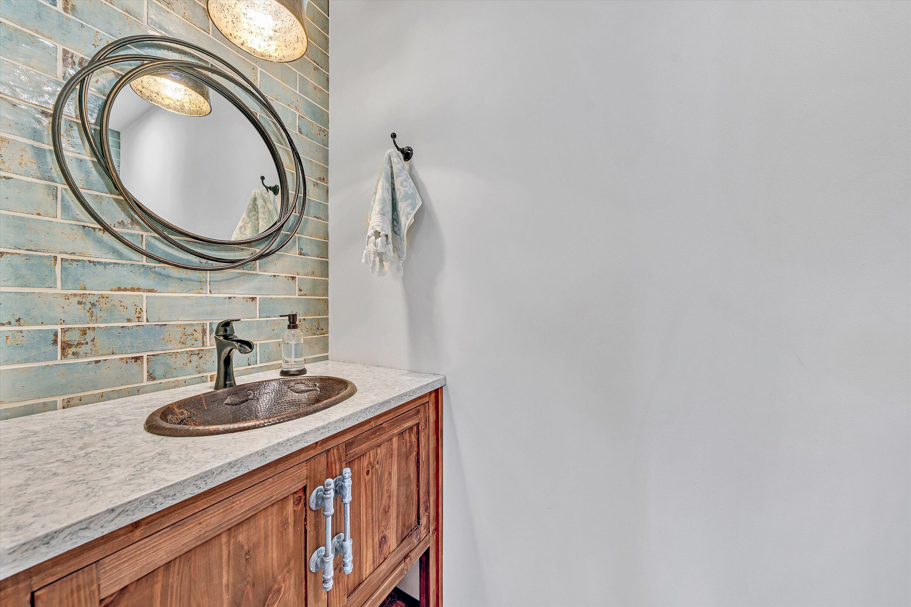 290 Winding Way Union Hall, VA 24176 - Photo 31 of 50 a bathroom with a sink and a mirror