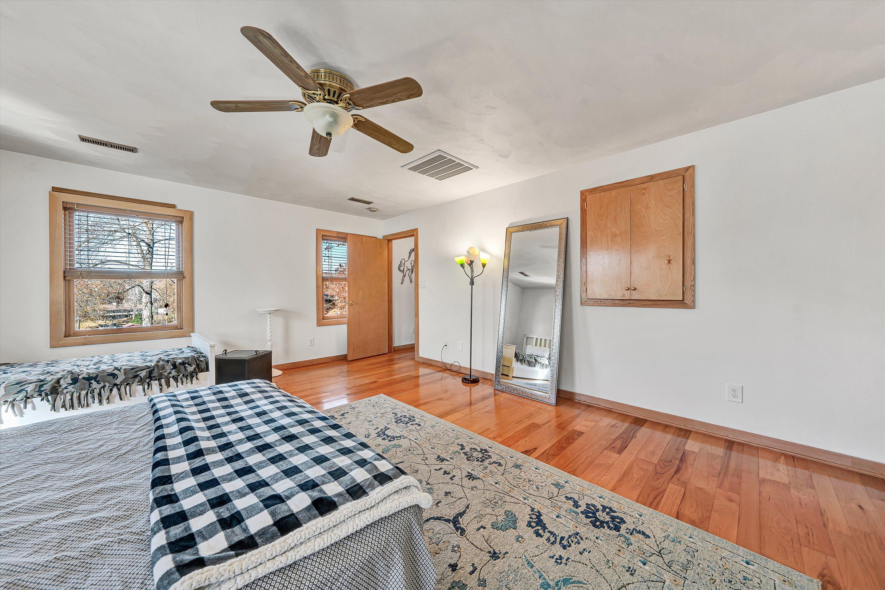290 Winding Way Union Hall, VA 24176 - Photo 36 of 50 a bedroom with a bed and wooden floor