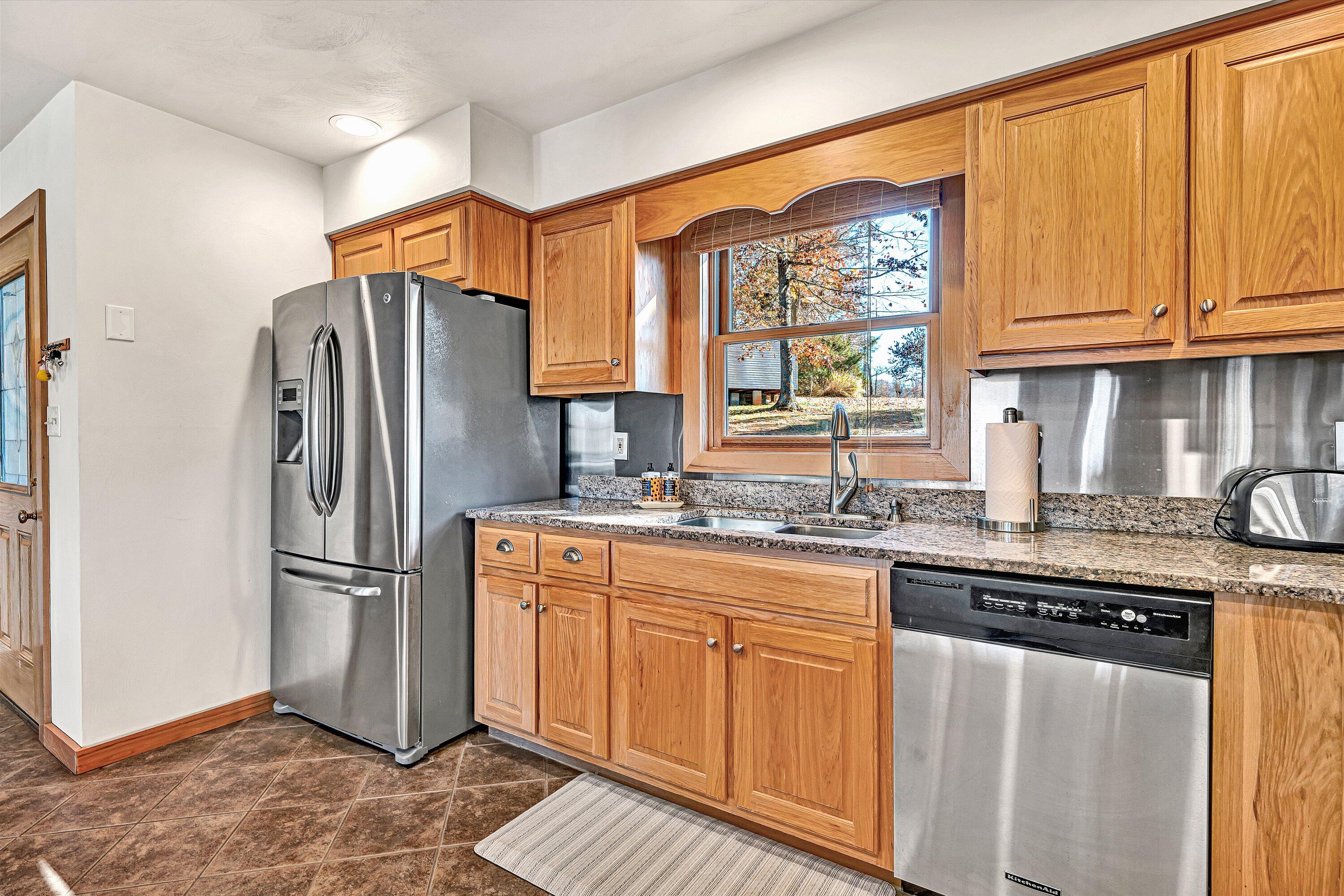 290 Winding Way Union Hall, VA 24176 - Photo 8 of 50 a kitchen with stainless steel appliances granite countertop a refrigerator and a sink