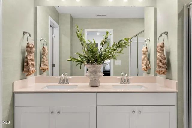 a bathroom with a sink a vanity and a mirror