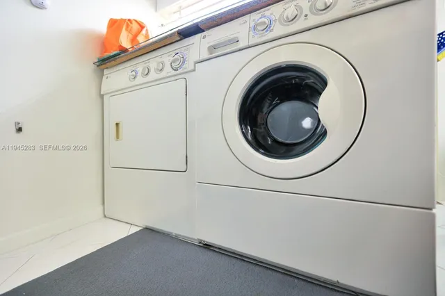 a utility room with dryer and washer