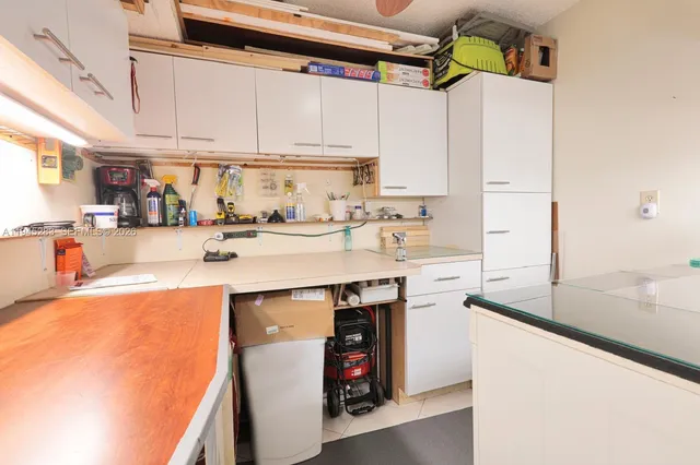 a kitchen with stainless steel appliances granite countertop a sink and cabinets