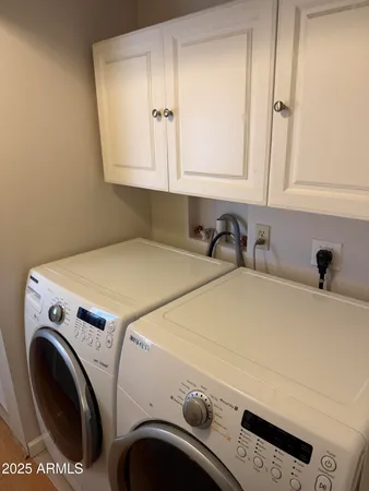 a white toilet sitting next to a shower curtain