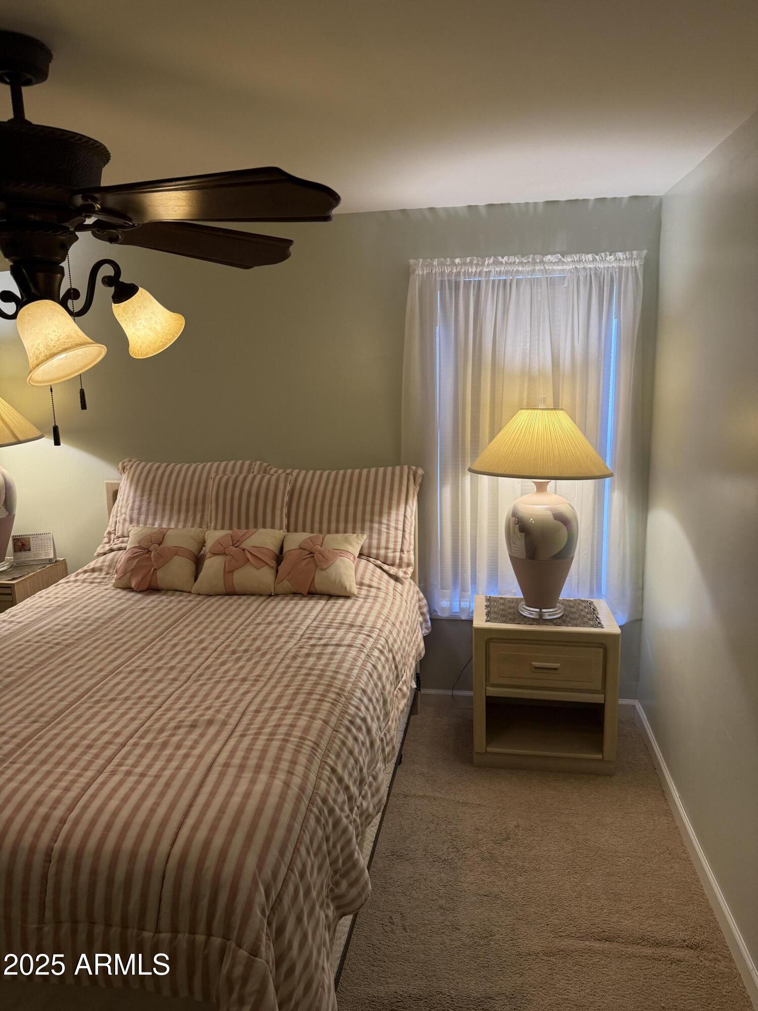 301 South Signal Butte Road, Unit FRNT Apache Junction, AZ 85120 - Photo 15 of 38 a bedroom with bed and a window