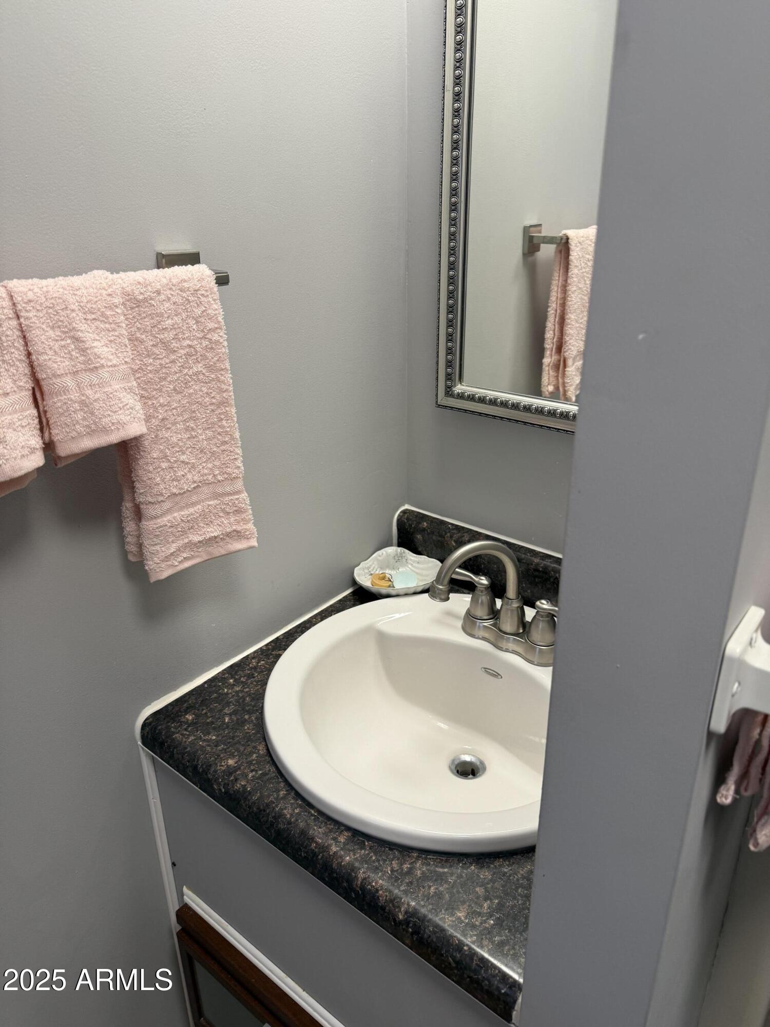 301 South Signal Butte Road, Unit FRNT Apache Junction, AZ 85120 - Photo 17 of 38 a bathroom with a sink and a mirror