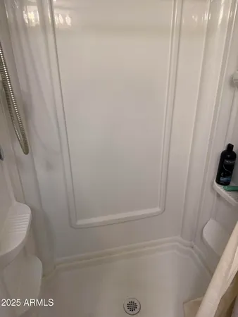 a white toilet sitting next to a sink