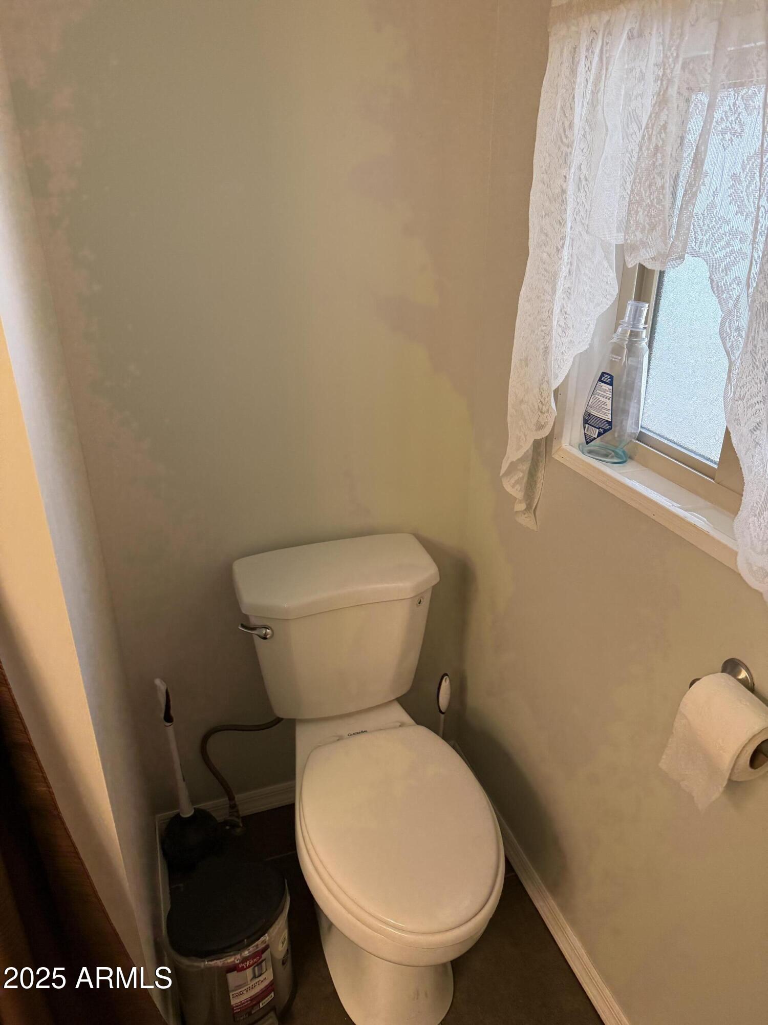 301 South Signal Butte Road, Unit FRNT Apache Junction, AZ 85120 - Photo 24 of 38 a white toilet sitting next to a sink