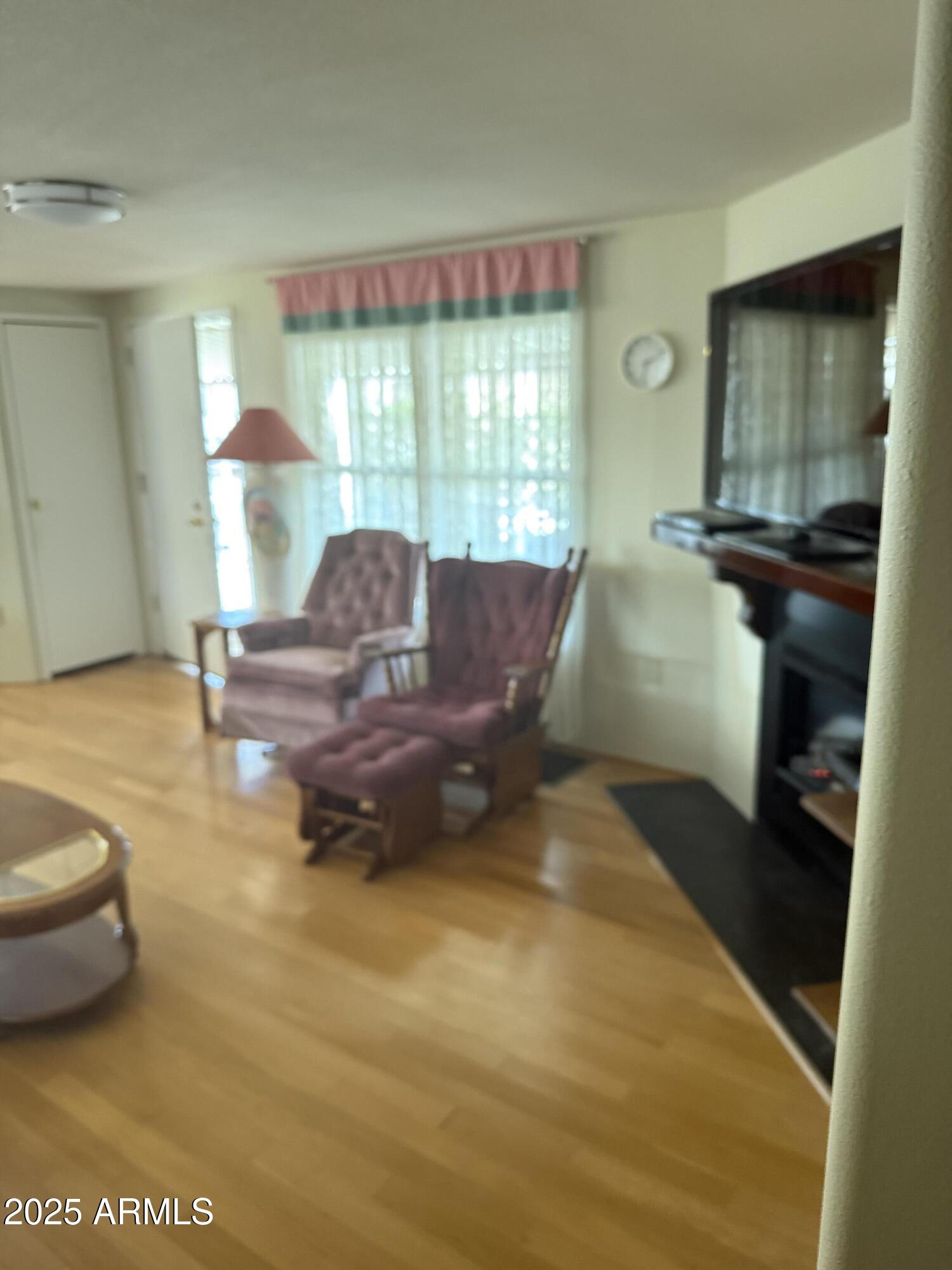 301 South Signal Butte Road, Unit FRNT Apache Junction, AZ 85120 - Photo 32 of 38 a living room with furniture and a window