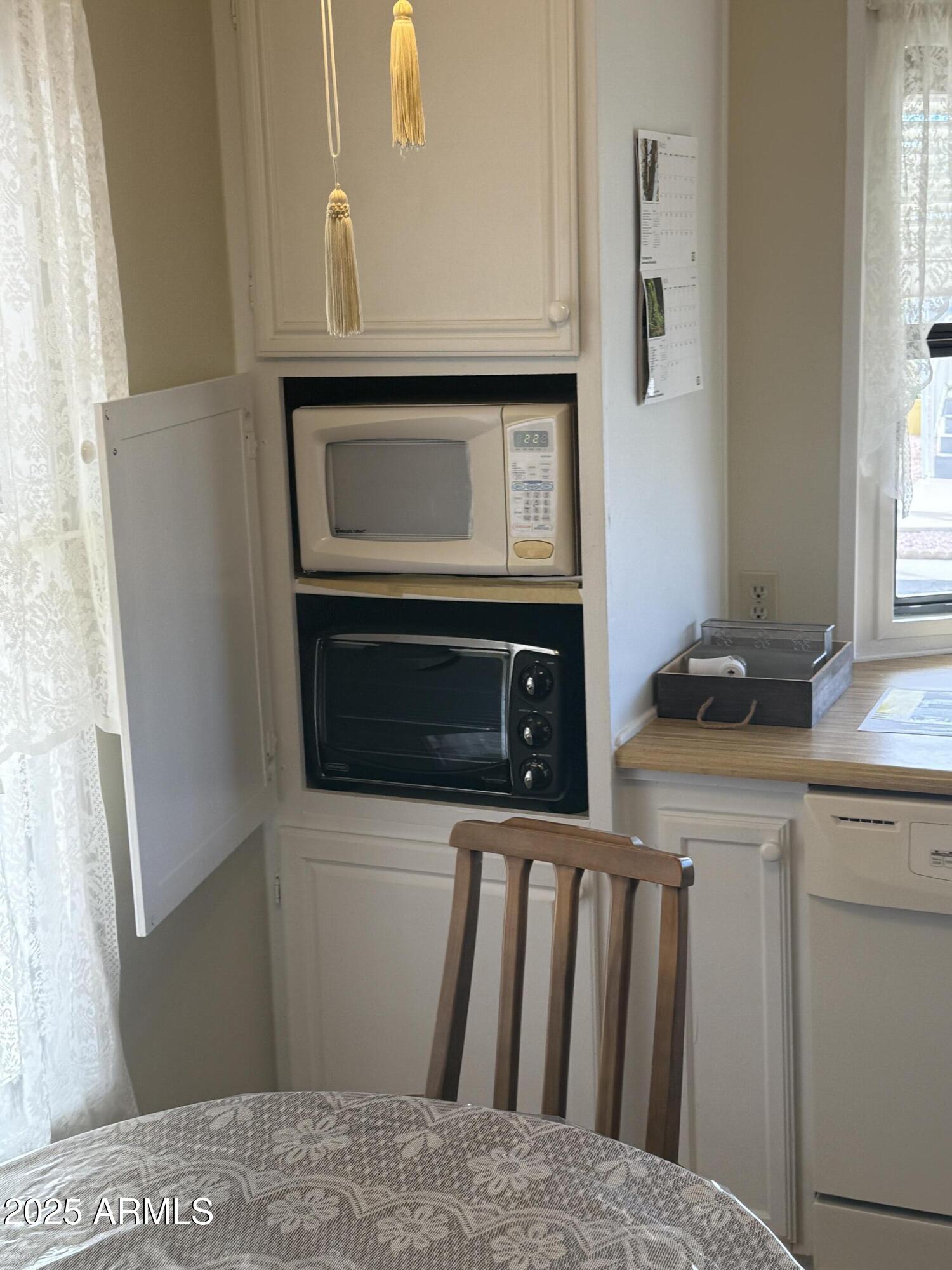 301 South Signal Butte Road, Unit FRNT Apache Junction, AZ 85120 - Photo 38 of 38 a kitchen with a stove and a microwave
