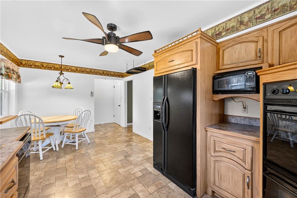 1705 Hassam Road Moon Township, PA 15108 - Photo 17 of 36 a kitchen with stainless steel appliances granite countertop a refrigerator a stove and a sink with granite countertops