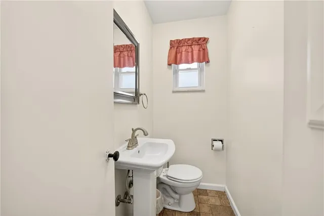 a bedroom with a bed and a night stand