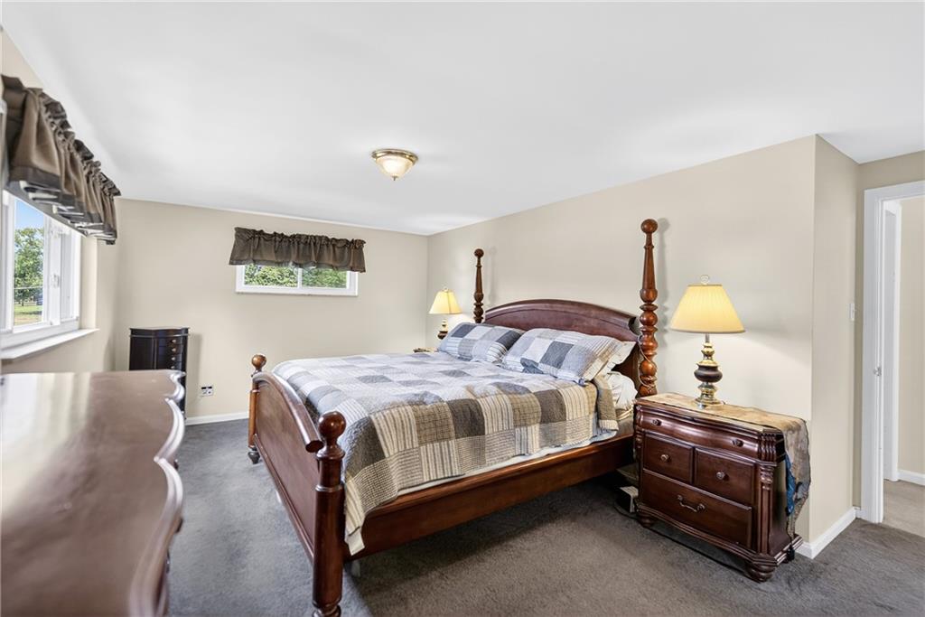 1705 Hassam Road Moon Township, PA 15108 - Photo 19 of 36 a bedroom with a bed and a night stand