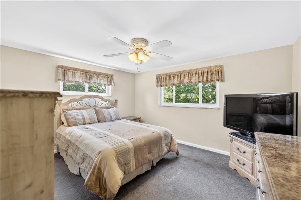 1705 Hassam Road Moon Township, PA 15108 - Photo 24 of 36 a bedroom with a bed and a flat screen tv