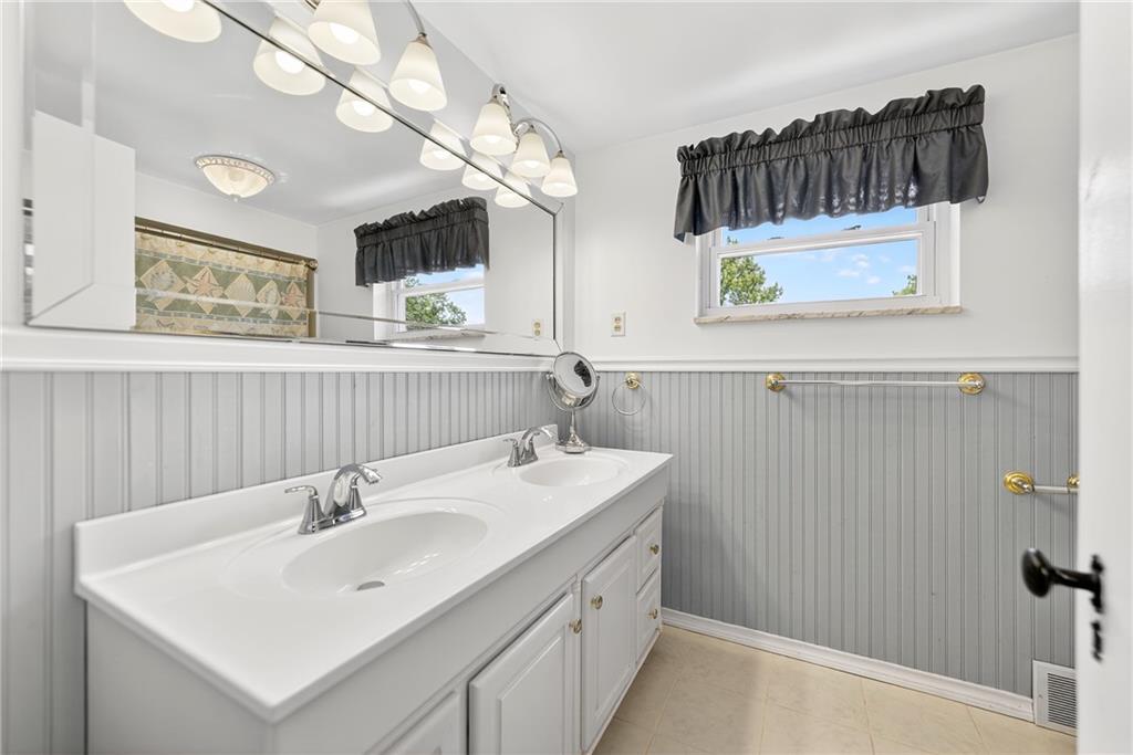 1705 Hassam Road Moon Township, PA 15108 - Photo 25 of 36 a bathroom with a sink and a mirror