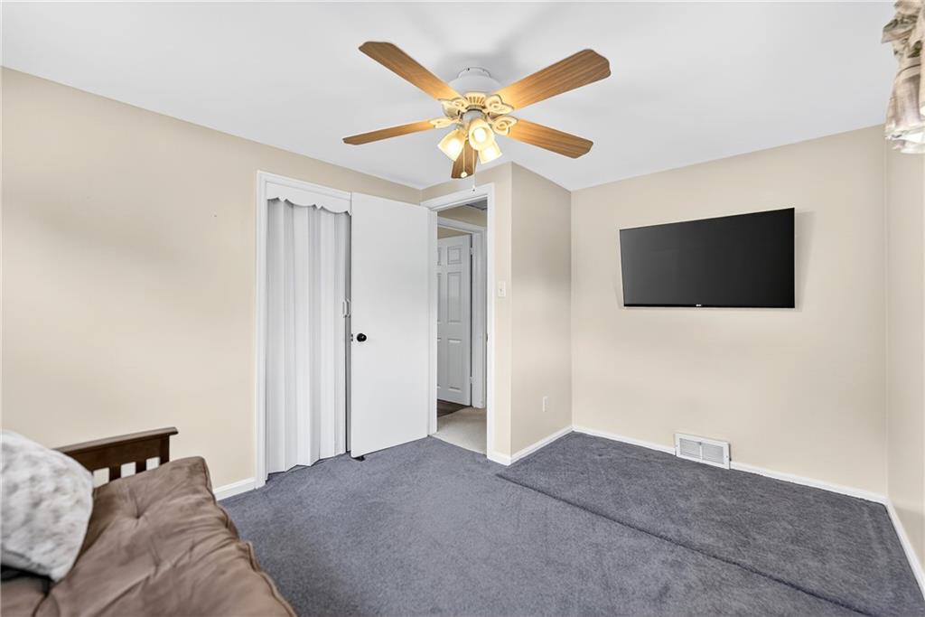 1705 Hassam Road Moon Township, PA 15108 - Photo 28 of 36 a living room with a flat screen tv and a ceiling fan