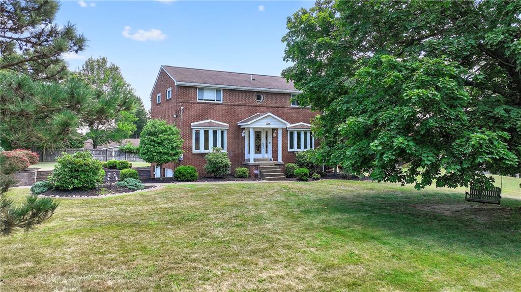 1705 Hassam Road Moon Township, PA 15108 - Photo 3 of 36 a front view of a house with a garden