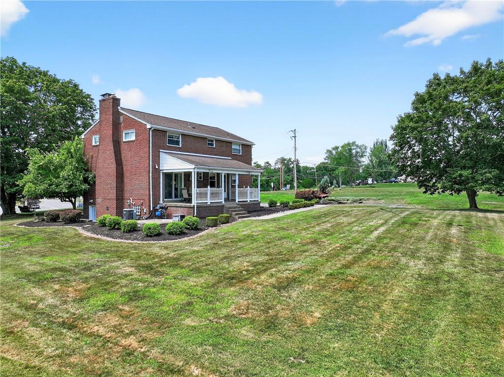 1705 Hassam Road Moon Township, PA 15108 - Photo 4 of 36 a view of a house with a big yard and potted plants