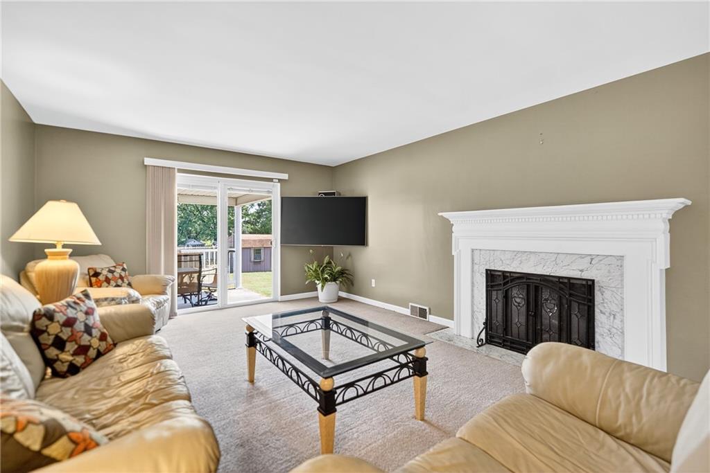 1705 Hassam Road Moon Township, PA 15108 - Photo 6 of 36 a living room with furniture large window and a fireplace