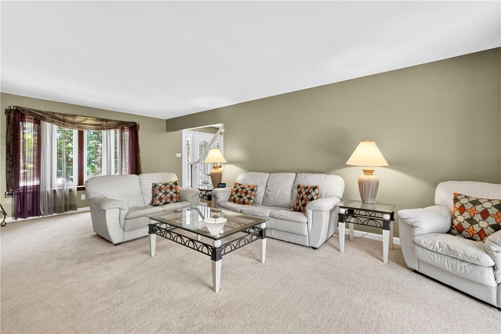 1705 Hassam Road Moon Township, PA 15108 - Photo 8 of 36 a living room with furniture and a large window