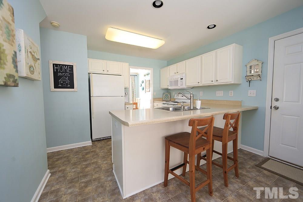 9101 Castleton Lane Raleigh, NC 27615 - Photo 10 of 25 Notice the breakfast bar!