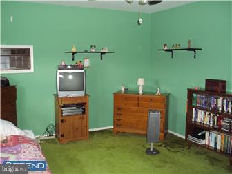 841 Avon Road Philadelphia, PA 19116 - Photo 6 of 12 a room with furniture and a flat screen tv