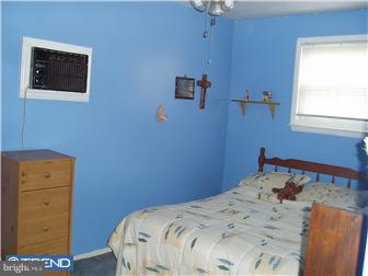 841 Avon Road Philadelphia, PA 19116 - Photo 8 of 12 a bedroom with a bed and a window