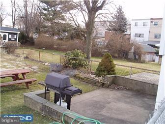 841 Avon Road Philadelphia, PA 19116 - Photo 10 of 12 a backyard of a house with table and chairs