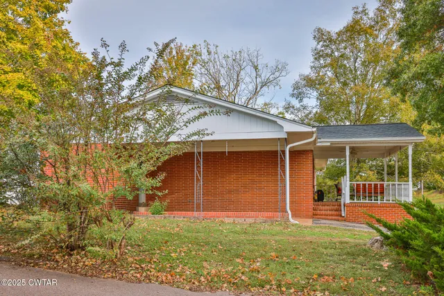 front view of a house with a garden