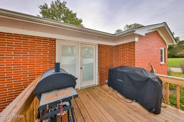 a view of a house with a door and wooden floor
