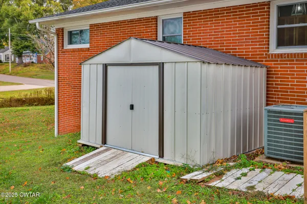 a backyard of a house with seating space