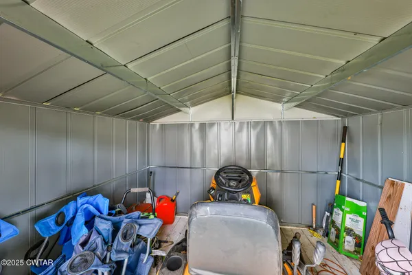 a bedroom with furniture and a chandelier
